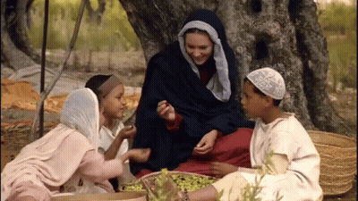 Group Sitting Under Tree One With White Hat GIF