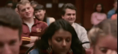 Group Sitting With Arms Crossed Looking At Something GIF