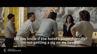 Group Standing Around Counter Do You Know If Hotel Is Pager Friendly GIF