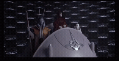 Group Standing Around Purple Object In Dark Room GIF