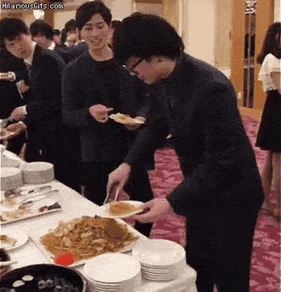 Group Standing Around Table With Hilariousgifs.com Sign GIF