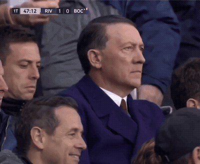 Group Standing Around Woman On Stool GIF