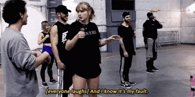 Group Standing Around Woman With Microphone GIF