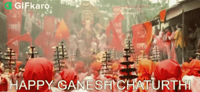 Group Standing Before Deity Statue GIF