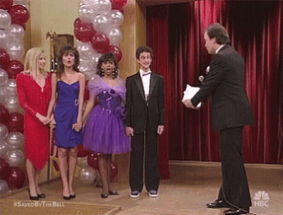 Group Standing Before Red Curtain With Balloons GIF
