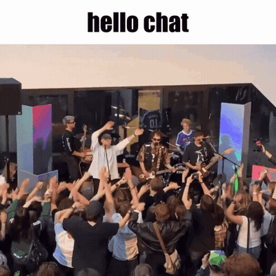 Group Standing Before Stage Saying Hello Chat GIF
