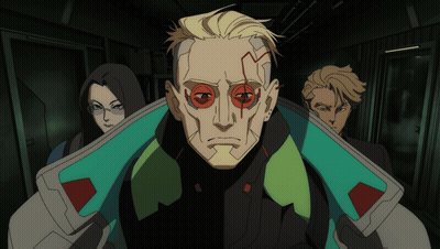 Group Standing In Dark Hallway With Red-Eyed Man GIF