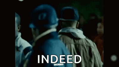 Group Standing In Dark Room With Indeed GIF