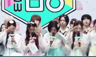 Group Standing In Front Of A-Na Sign GIF