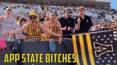 Group Standing In Front Of App State Bitches Banner GIF