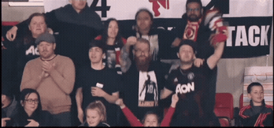 Group Standing In Front Of Banner Saying Tack GIF