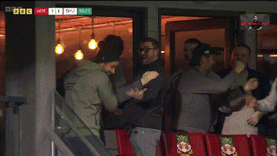 Group Standing In Front Of BBC Window GIF