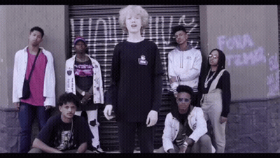 Group Standing In Front Of Building Saying Fora GIF