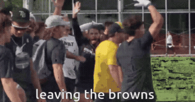 Group Standing In Front Of Building Saying Leaving The Browns GIF