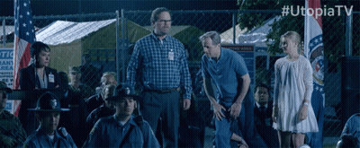 Group Standing In Front Of Chain Link Fence #Utopiatv GIF