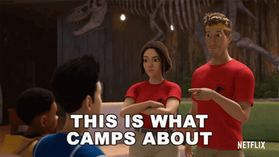 Group Standing In Front Of Dinosaur Skeleton Man Says This Is What Camps About GIF