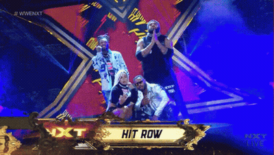 Group Standing In Front Of Hit Row Banner GIF