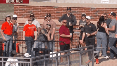 Group Standing In Front Of Home Run Sign GIF