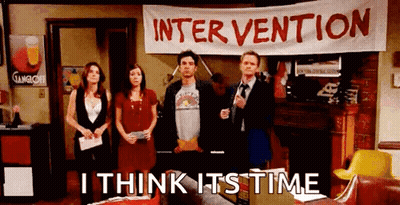 Group Standing In Front Of Intervention Banner GIF