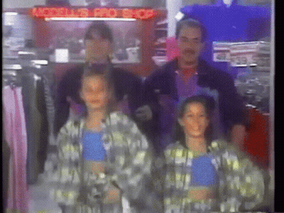 Group Standing In Front Of Model Pro Shop GIF