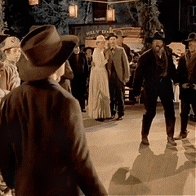 Group Standing In Front Of Molly Building GIF