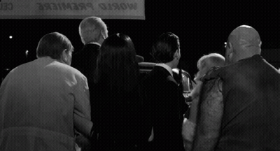 Group Standing In Front Of Mosko Brewiere Sign GIF