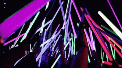 Group Standing In Front Of Neon Lights GIF
