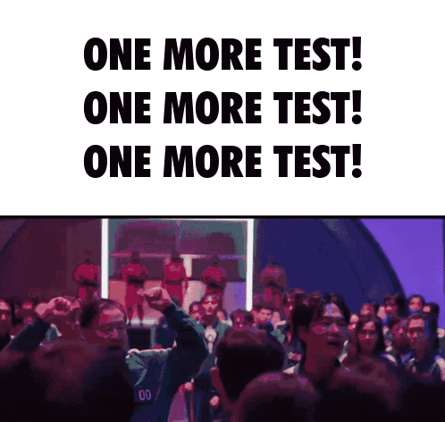 Group Standing In Front Of One More Test Sign GIF
