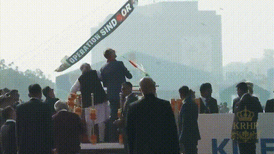 Group Standing in Front of Operation Sind Or Banner