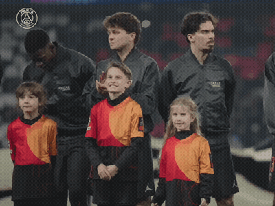 Group Standing In Front Of Paris Sign GIF