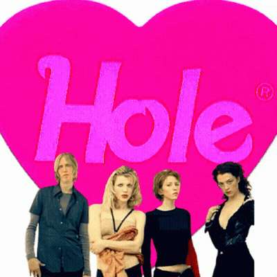 Group Standing In Front Of Pink Heart Saying Hole GIF