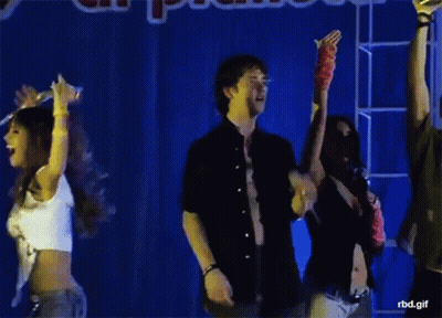 Group Standing In Front Of Planet Sign GIF