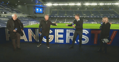 Group Standing In Front Of Rangers TV Banner GIF