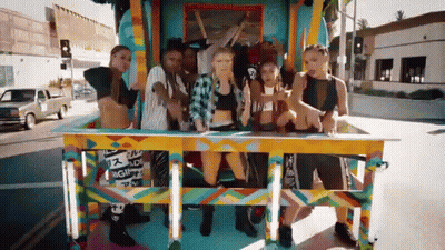 Group Standing In Front Of Reggae Wagon GIF