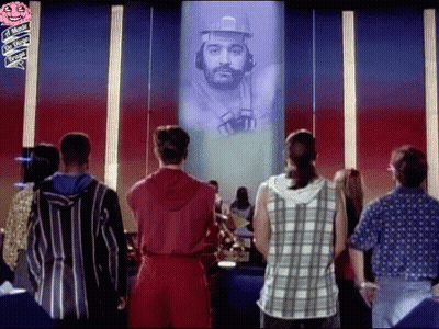 Group Standing In Front Of Screen With Man GIF