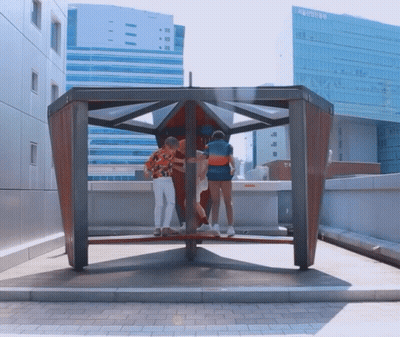 Group Standing In Front Of Seoul Building GIF