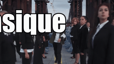 Group Standing In Front Of Sique Sign GIF