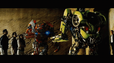 Group Standing In Front Of Transformer Number 4 GIF