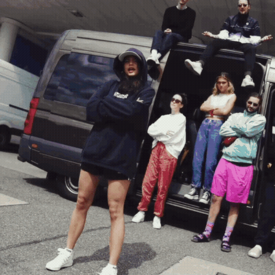 Group Standing In Front Of Van With Reebok Hoodie GIF