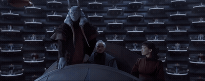 Group Standing In Front Of Wall Saying Order GIF