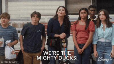 Group Standing in Front of We're the Mighty Ducks Trailer