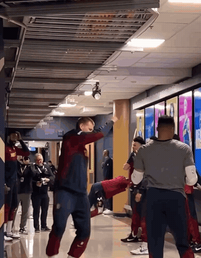 Group Standing In Hallway One In Nike Sweater GIF
