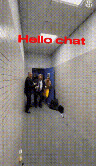 Group Standing In Hallway Saying Hello Chat GIF