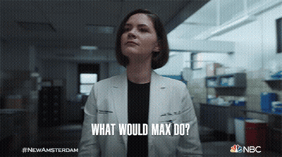 Group Standing In Hallway With Stair Sign GIF