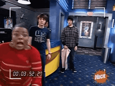 Group Standing In Room With Nick Logo GIF
