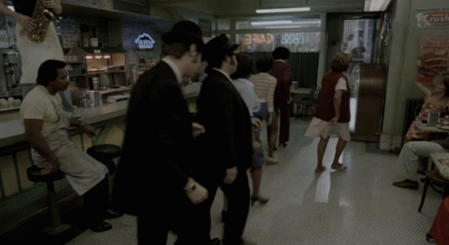 Group Standing Near Crush Sign GIF