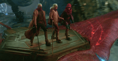 Group Standing On Red Surface GIF