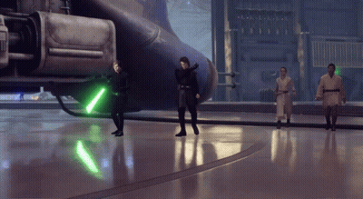 Group Standing With Green Lightsaber GIF