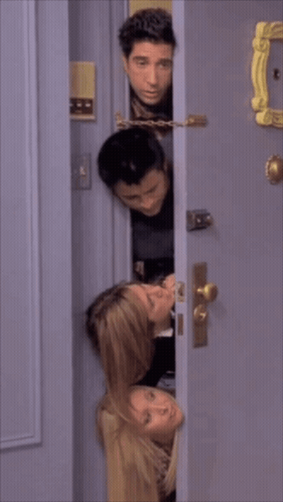Group Sticking Heads Out Of Doorway GIF