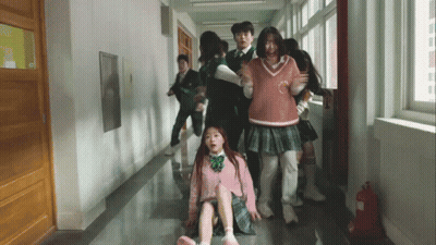 Group Walking Down Hallway With Fire Extinguisher GIF